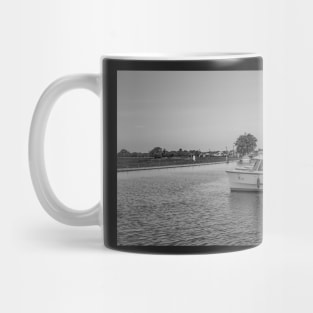 A view down the River Thurne in Potter Heigham, Norfolk Mug